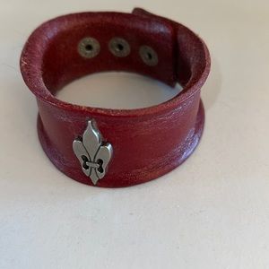 Plunder Gorgeous leather cuff bracelet with fleur-de-lis Charm attached.